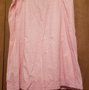 Light pink skirt with eyelet details.
